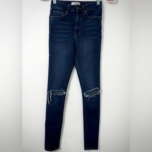 Forever 21 Dark-wash high waist ripped skinny jeans. Size 24.